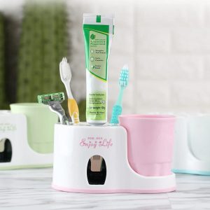 Toothbrush holder with toothpaste dispenser